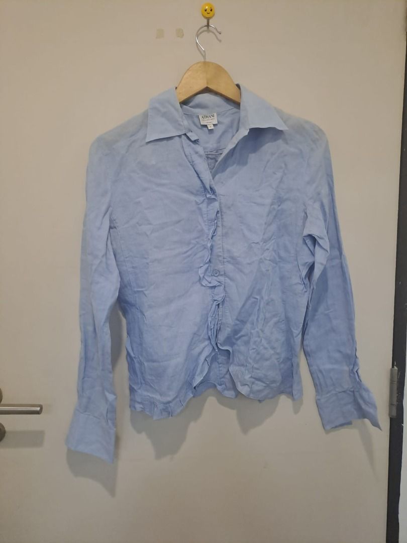 Armani linen longsleeve (Category: Longsleeves) located in Mandaluyong City. Submitted by epicowl-c93c (Listing ID 1461352198, Image 1). Description: This is an Armani Collezioni light blue linen blouse featuring a classic collar, button-up front, and distinct raw-edge ruffle detailing along the central placket and hemline..