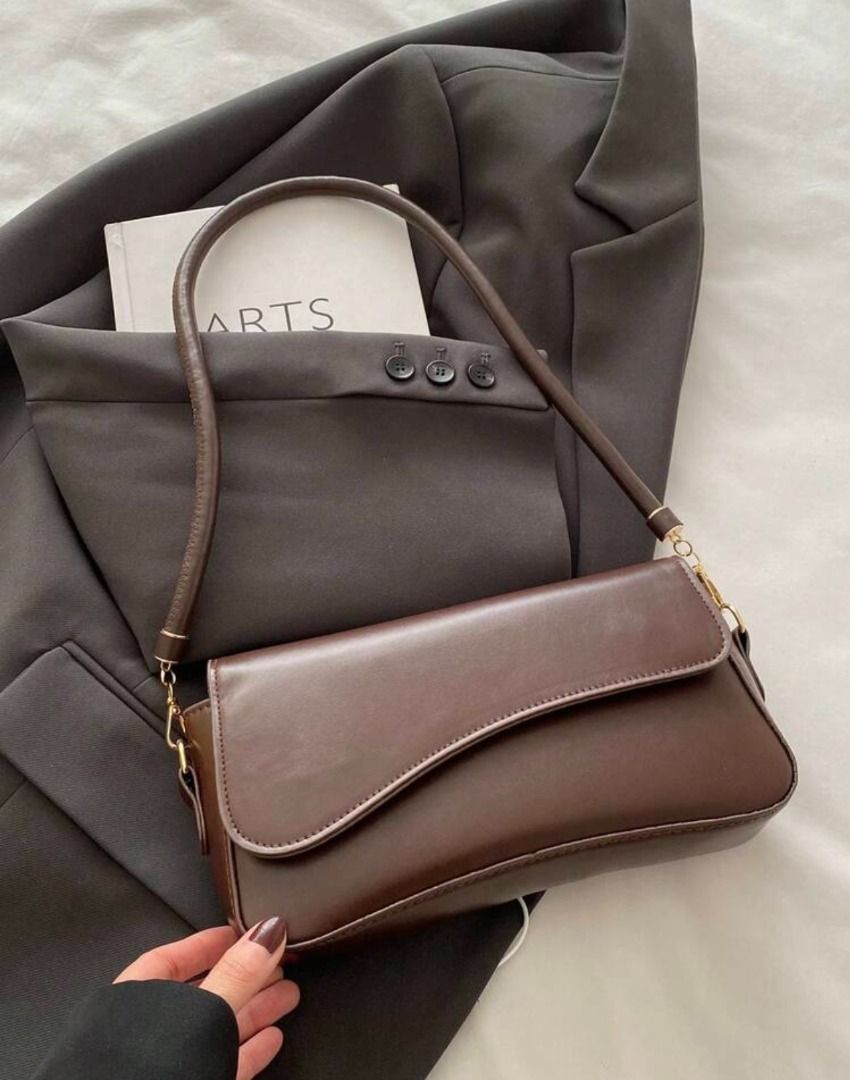 Assymetrical Shoulder Bag (Category: Luxury Bags & Wallets) located in Balanga. Submitted by shopbykk (Listing ID 1461541866, Image 1). Description: Never been used Dark brown color .