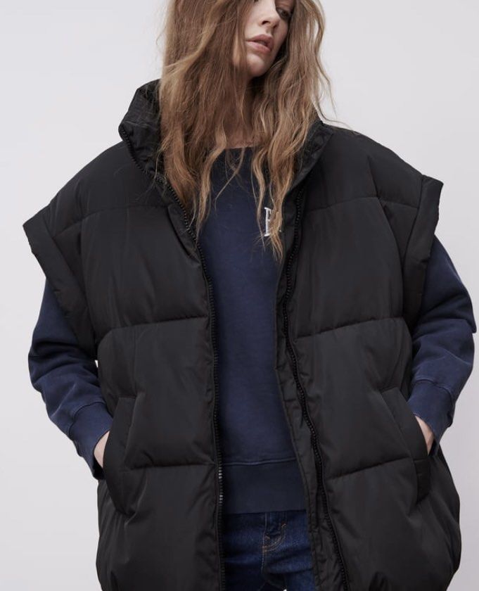 Zara Black Puffer Vest Sleeveless Jacket Oversize (Category: Coats, Jackets and Outerwear) located in Makati City. Submitted by cheapipie (Listing ID 1461413780, Image 2). Description: - Black sleeveless puffer vest - High collar with zip-up front - Padded for warmth and style - Ideal for layering over sweatshirts or hoodies - Perfect for cooler weather - Versatile wardrobe addition.
