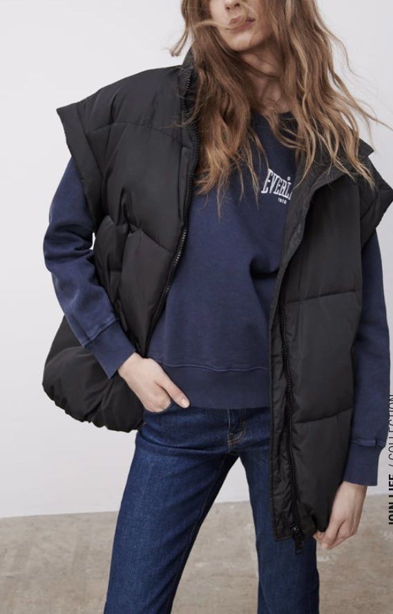 Zara Black Puffer Vest Sleeveless Jacket Oversize (Category: Coats, Jackets and Outerwear) located in Makati City. Submitted by cheapipie (Listing ID 1461413780, Image 3). Description: - Black sleeveless puffer vest - High collar with zip-up front - Padded for warmth and style - Ideal for layering over sweatshirts or hoodies - Perfect for cooler weather - Versatile wardrobe addition.