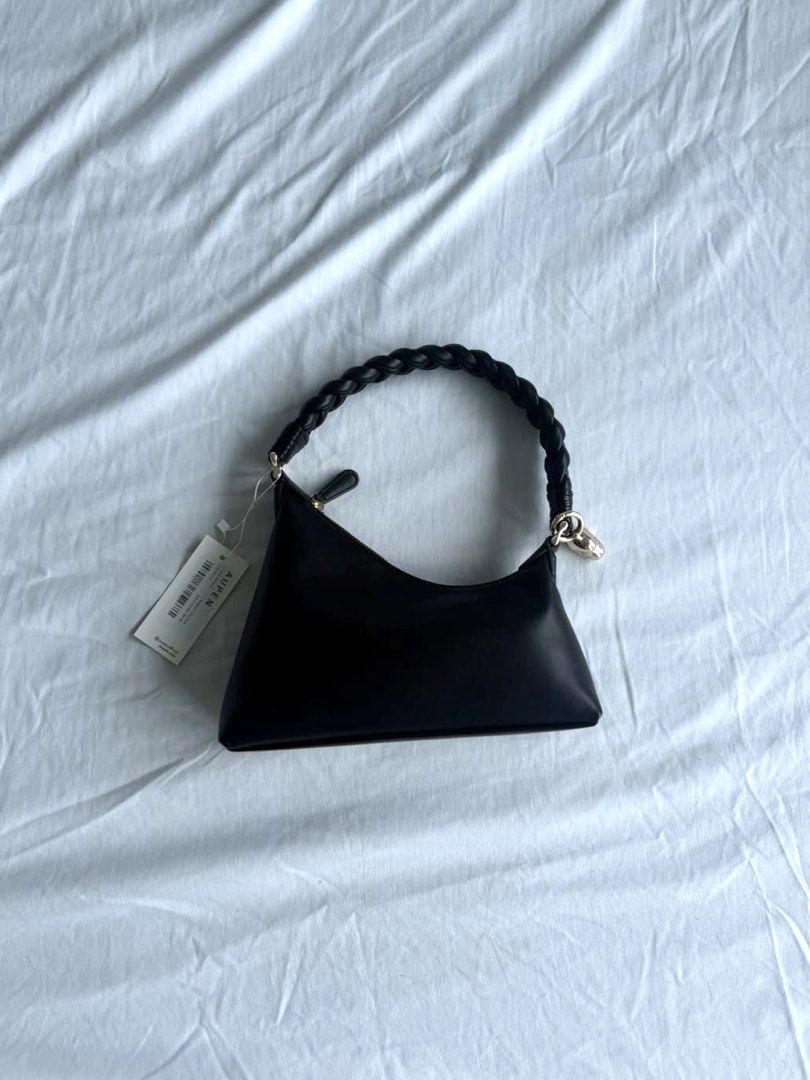 AUPEN Black Leather Shoulder Bag with Braided Handle (Category: Shoulder Bags) located in Quezon City. Submitted by jhosephllorente (Listing ID 1461452472, Image 1). Description: - Chic AUPEN black shoulder bag - Unique braided handle - Elegant gold charm detail - Comes with original dust bag - Versatile: Great for everyday use or a night out - Minimalist and stylish design.