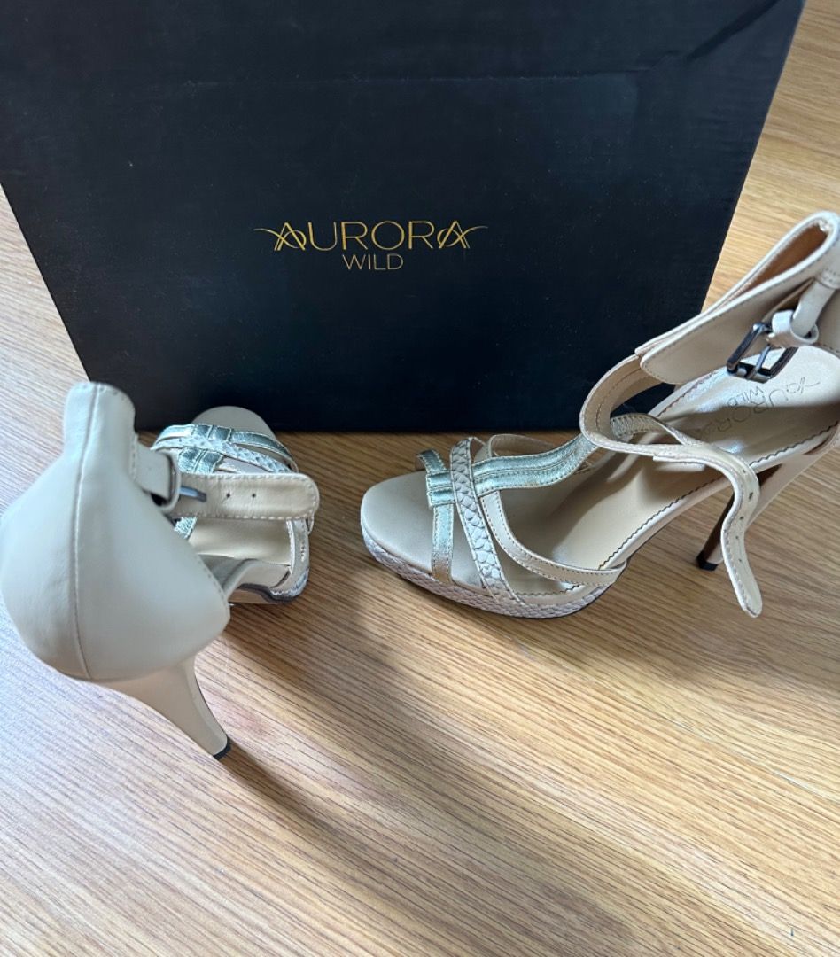 Aurora Wild, Snake & Leather Heels Size 37 (Category: Heels) located in Mandaluyong City. Submitted by unworntobarelyworn (Listing ID 1461337018, Image 2). Description: Condition: 8/10 - Aurora Wild heels (worn only 2x) - Nude with Gold/Silver & Light pink color - Snake and leather material - Size 37 - Comes with original box - Includes extra heel tips - Minor scuffs on heel (as pictured) - Great for dressing up - Bought in Singapore for SGD250.