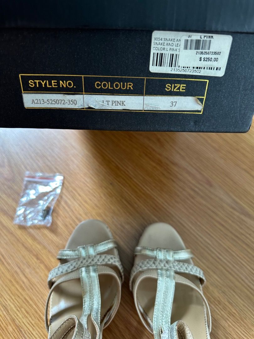 Aurora Wild, Snake & Leather Heels Size 37 (Category: Heels) located in Mandaluyong City. Submitted by unworntobarelyworn (Listing ID 1461337018, Image 3). Description: Condition: 8/10 - Aurora Wild heels (worn only 2x) - Nude with Gold/Silver & Light pink color - Snake and leather material - Size 37 - Comes with original box - Includes extra heel tips - Minor scuffs on heel (as pictured) - Great for dressing up - Bought in Singapore for SGD250.