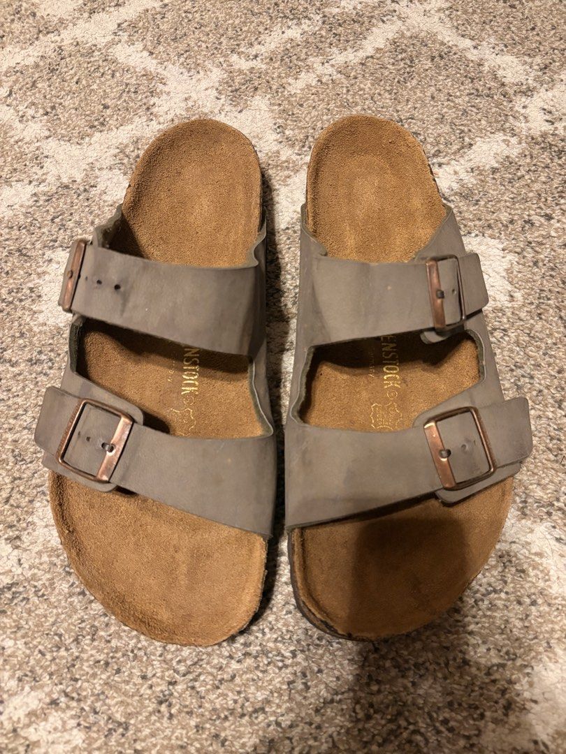 Auth Preloved Birkenstock Arizona (Category: Slippers & Slides) located in Paranaque City. Submitted by silentstone.dolphin (Listing ID 1461501736, Image 1). Description: Stone Color.. Brass Buckle.. Visible Print.. Clean&Ready to Wear.. Size 45RF.. Best Seller!🥳 Super Gwapo in Actual😍.