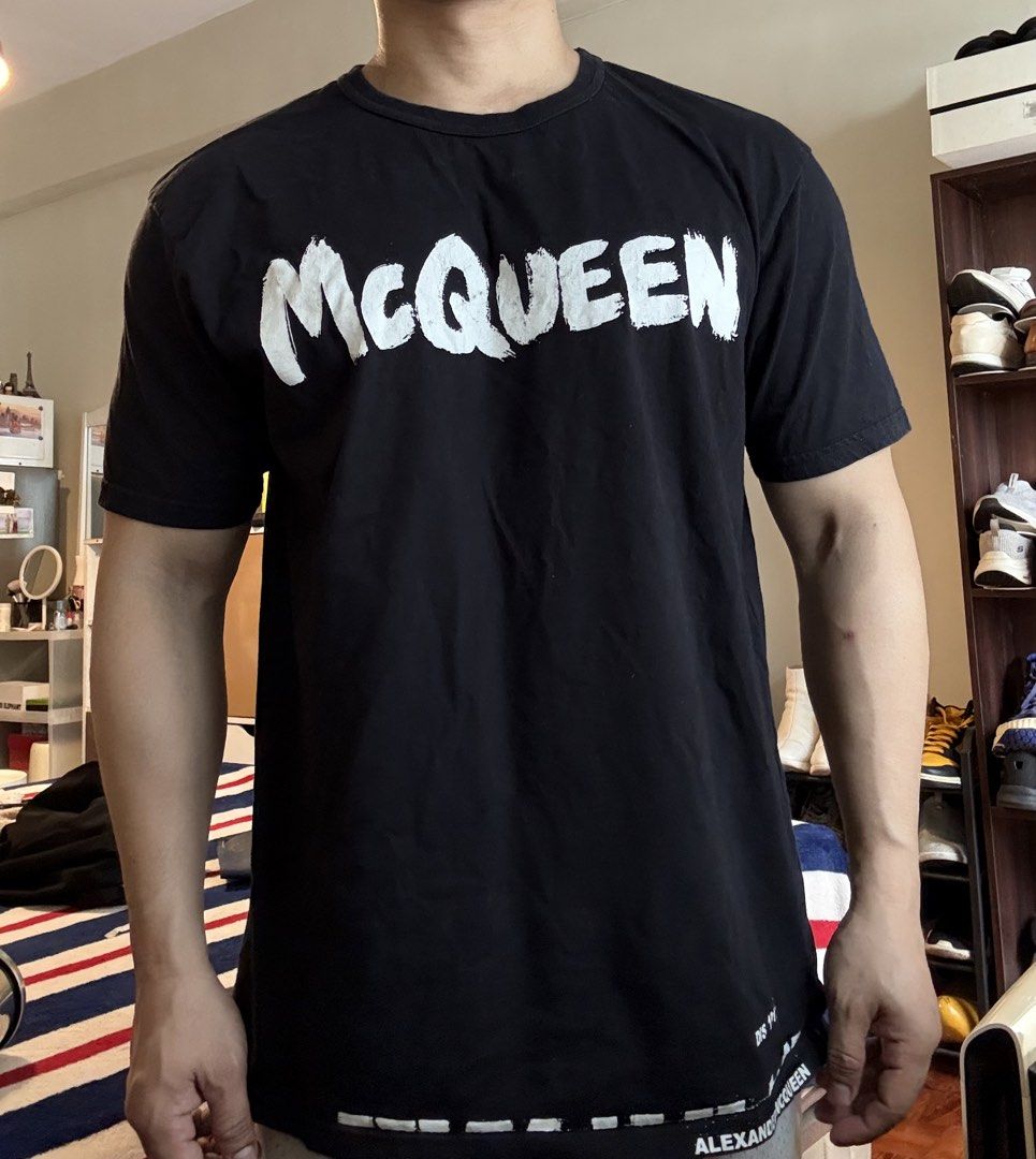 Authentic Alexander McQueen Graffiti Graphic Shirt (Category: Luxury Apparel) located in Mandaluyong City. Submitted by wear_your_style (Listing ID 1461384019, Image 3). Description: Made in Italy. Black na black pa po yan. Used a few times. Malambot. 100% cotton. Yung graffiti print nya ay parang painted talaga siya, like you can touch it. Size M on tag: approx 21 inches wide and 27 inches long. No issue: just maybe signs of wash and wear. Will 