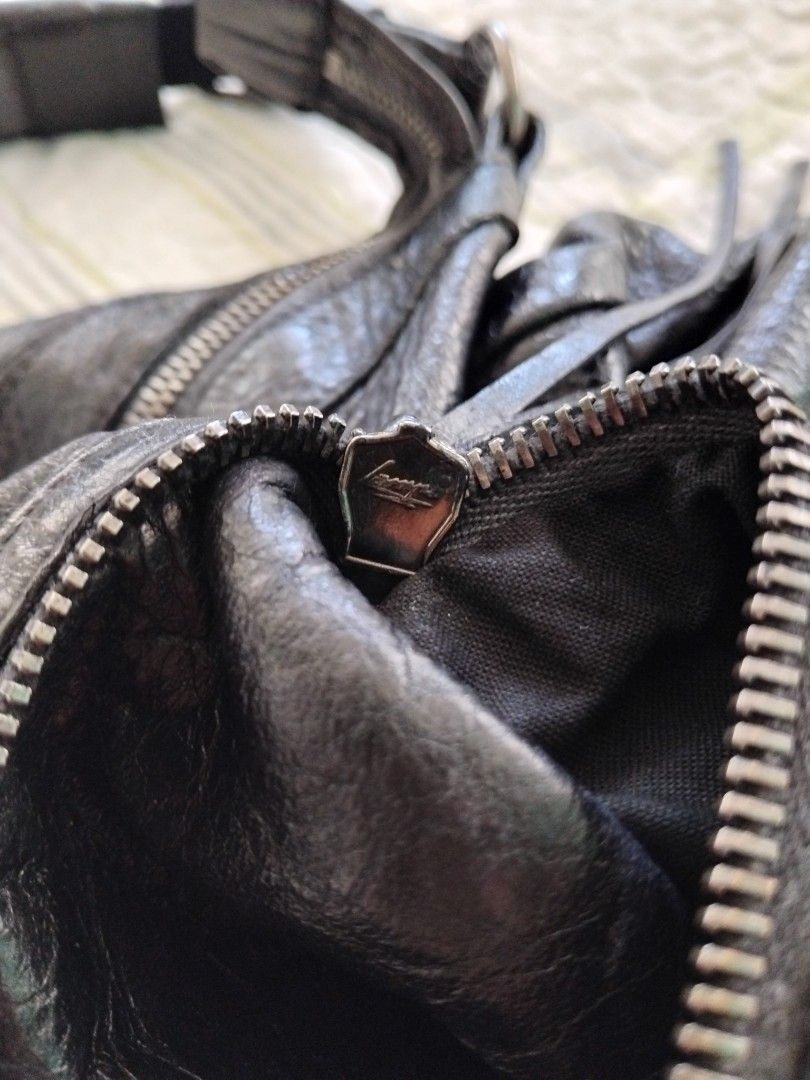 Authentic Balenciaga Courier Shoulder Bag in Black (Category: Luxury Bags & Wallets) located in Manila. Submitted by daronandtruffles (Listing ID 1461329415, Image 3). Description: Selling my well loved AUTHENTIC 2nd Balenciaga bag collection size: Large Material: soft lambskin leather no issues never been recolored 🧡 - Authentic - Signature Balenciaga buckle details - Exterior zip pockets - Distressed leather finish for a vintage look - Black f