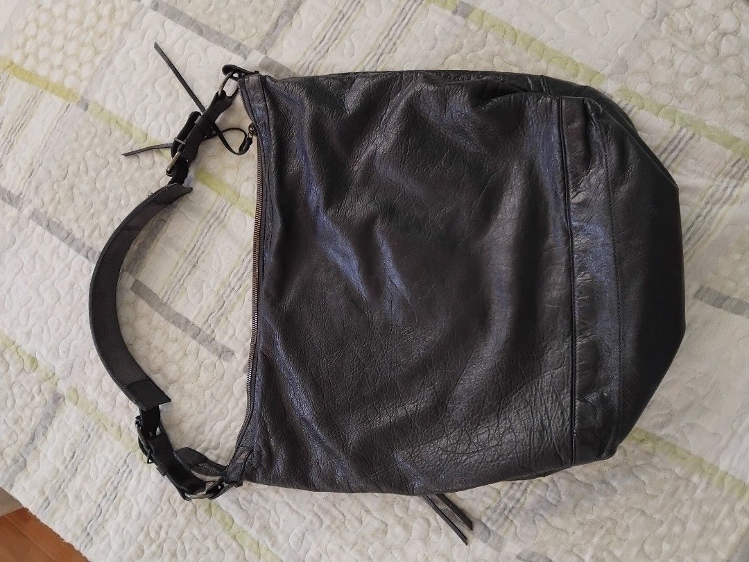 Authentic Balenciaga Courier Shoulder Bag in Black (Category: Luxury Bags & Wallets) located in Manila. Submitted by daronandtruffles (Listing ID 1461329415, Image 2). Description: Selling my well loved AUTHENTIC 2nd Balenciaga bag collection size: Large Material: soft lambskin leather no issues never been recolored 🧡 - Authentic - Signature Balenciaga buckle details - Exterior zip pockets - Distressed leather finish for a vintage look - Black f