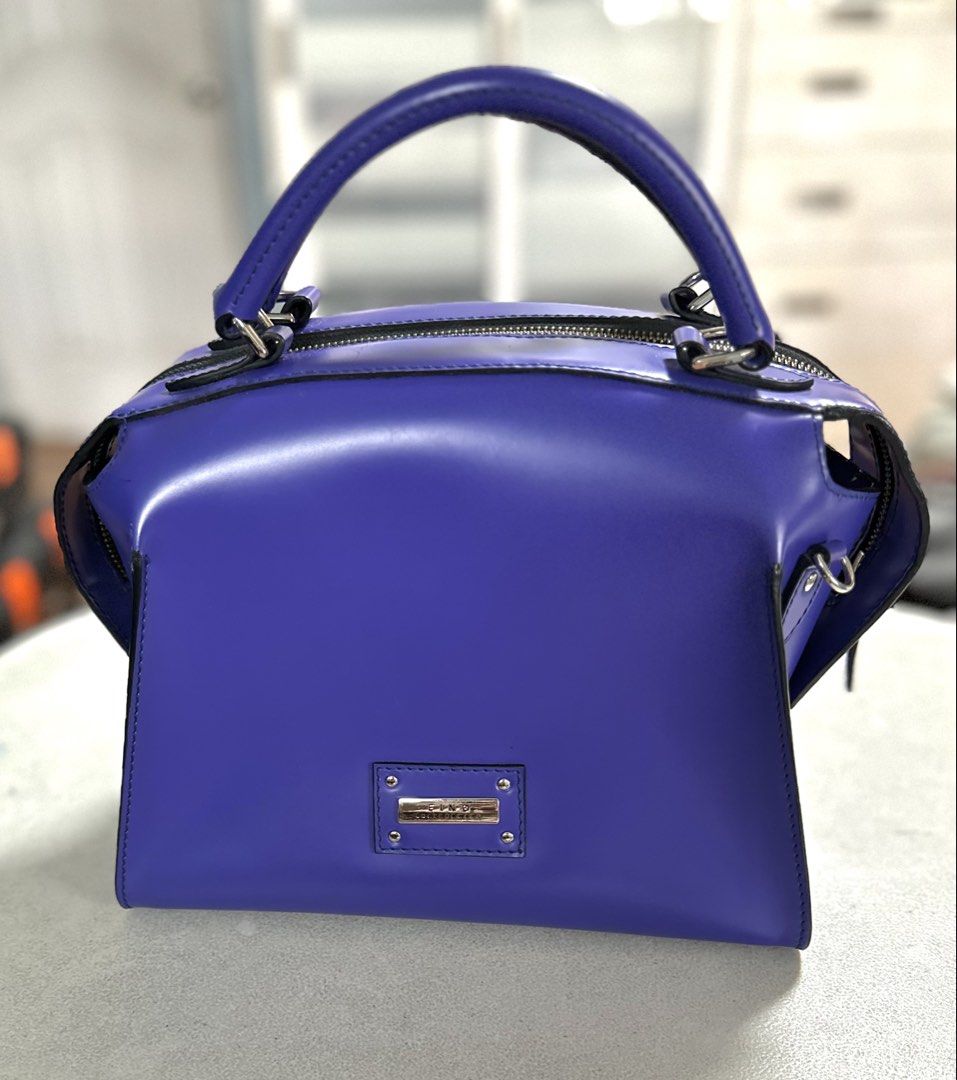AUTHENTIC FINO LEATHER BAG (Category: Shoulder Bags) located in Manila. Submitted by aileenjaraza (Listing ID 1461424484, Image 2). Description: Authentic FINO leather bag. Hardly used. Color purplish-blue, trapezoidal shape. Has long strap so can be worn as a shoulder or cross-body bag. Measurement: Height of body- 8.25” up to top of strap- 12.75”; Bottom: 10.25 x 6.25”. Very roomy inspite of size. .
