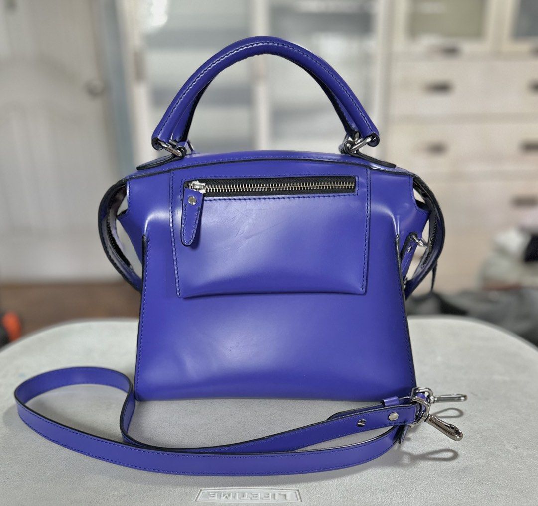 AUTHENTIC FINO LEATHER BAG (Category: Shoulder Bags) located in Manila. Submitted by aileenjaraza (Listing ID 1461424484, Image 1). Description: Authentic FINO leather bag. Hardly used. Color purplish-blue, trapezoidal shape. Has long strap so can be worn as a shoulder or cross-body bag. Measurement: Height of body- 8.25” up to top of strap- 12.75”; Bottom: 10.25 x 6.25”. Very roomy inspite of size. .
