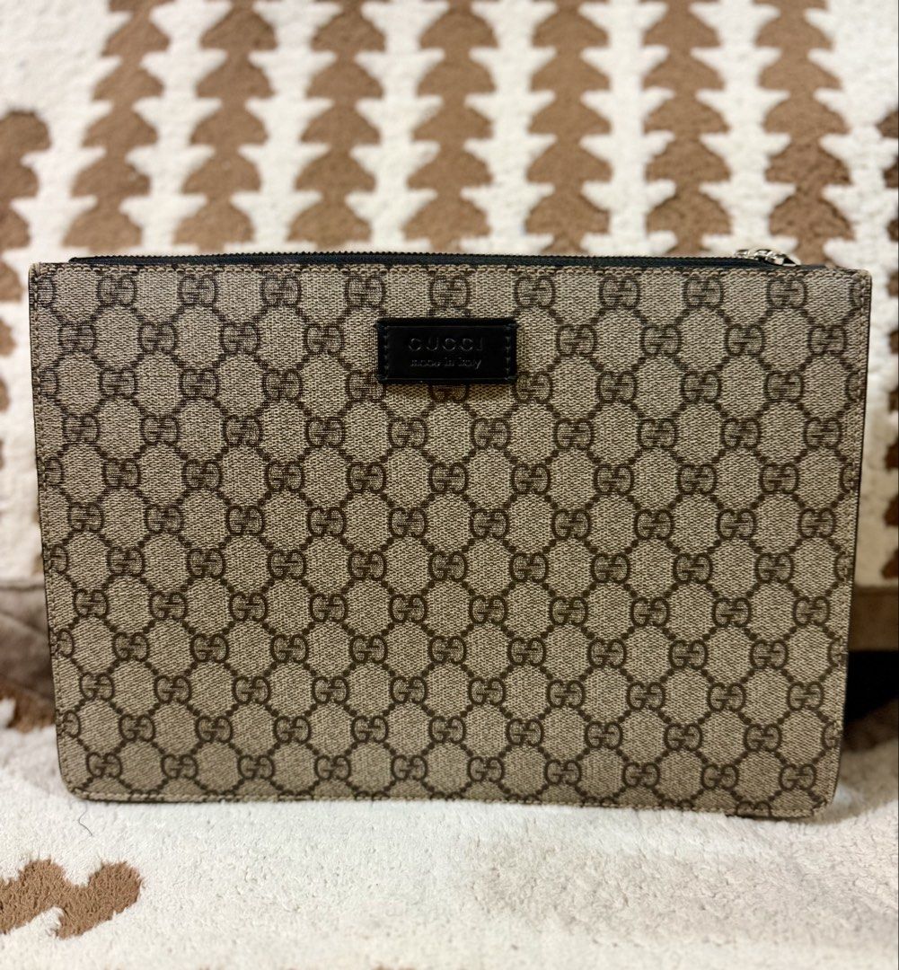 Authentic Gucci Multi Use Clutch Bag (Category: Clutches) located in Mandaluyong City. Submitted by topinvestment (Listing ID 1461476816, Image 1). Description: Product Details: Material: GG Monogram Leather Canvas double zip way Hardware: Silver-tone zipper closure Origin: Made in Italy Condition Notes: Overall Exterior: Clean canvas with no major marks. Zipper runs smoothly. Interior: Clean interior suede lining with minor signs of gentle use C