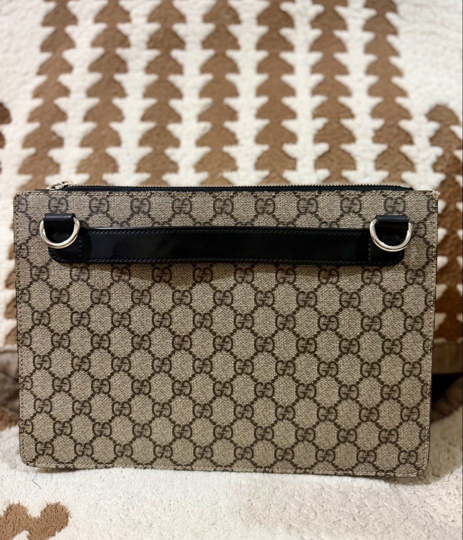 Authentic Gucci Multi Use Clutch Bag (Category: Clutches) located in Mandaluyong City. Submitted by topinvestment (Listing ID 1461476816, Image 2). Description: Product Details: Material: GG Monogram Leather Canvas double zip way Hardware: Silver-tone zipper closure Origin: Made in Italy Condition Notes: Overall Exterior: Clean canvas with no major marks. Zipper runs smoothly. Interior: Clean interior suede lining with minor signs of gentle use C