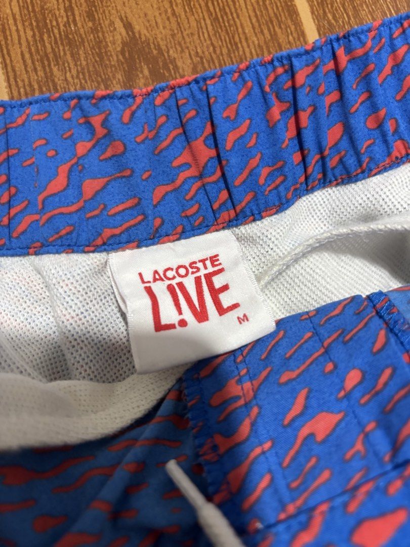Authentic Lacoste Men’s Swim Shorts (Blue/Orange Pattern) 🐊🌊 (Category: Shorts) located in Tarlac. Submitted by jekzxkie (Listing ID 1461489944, Image 3). Description: Authentic Lacoste Swim Shorts / Trunks. Super fresh and unique blue/orange abstract pattern, perfect for your beach trips, pool sessions, or casual summer look! Condition: Excellent condition / No issues / No flaws Size on Tag: Medium Waistline: 32 to 36 inches (Garterized / Stre