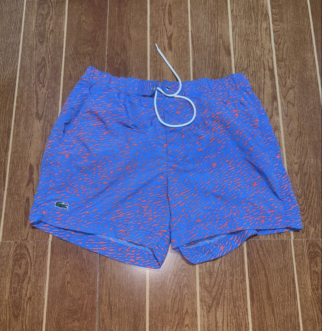 Authentic Lacoste Men’s Swim Shorts (Blue/Orange Pattern) 🐊🌊 (Category: Shorts) located in Tarlac. Submitted by jekzxkie (Listing ID 1461489944, Image 1). Description: Authentic Lacoste Swim Shorts / Trunks. Super fresh and unique blue/orange abstract pattern, perfect for your beach trips, pool sessions, or casual summer look! Condition: Excellent condition / No issues / No flaws Size on Tag: Medium Waistline: 32 to 36 inches (Garterized / Stre