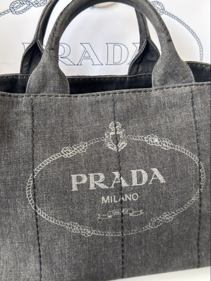 Authentic Prada Canapa Denim in Charcoal wash (Category: Luxury Bags & Wallets) located in Manila. Submitted by fajardoeyak108 (Listing ID 1461329969, Image 3). Description: Trendy denim bags nowadays‼️ No rips on denims No significant flaw except for signs of usage With dustbag strap n cards Las Pinas meet up.