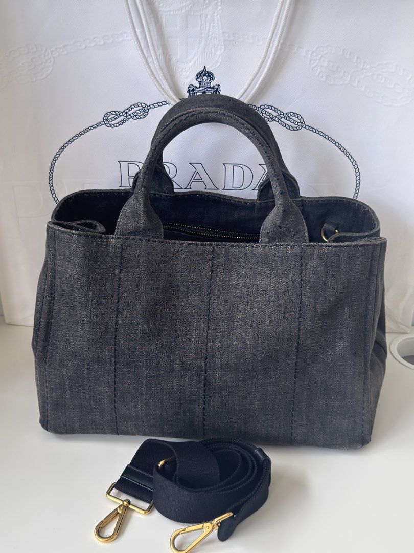 Authentic Prada Canapa Denim in Charcoal wash (Category: Luxury Bags & Wallets) located in Manila. Submitted by fajardoeyak108 (Listing ID 1461329969, Image 2). Description: Trendy denim bags nowadays‼️ No rips on denims No significant flaw except for signs of usage With dustbag strap n cards Las Pinas meet up.