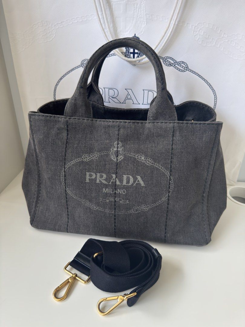 Authentic Prada Canapa Denim in Charcoal wash (Category: Luxury Bags & Wallets) located in Manila. Submitted by fajardoeyak108 (Listing ID 1461329969, Image 1). Description: Trendy denim bags nowadays‼️ No rips on denims No significant flaw except for signs of usage With dustbag strap n cards Las Pinas meet up.