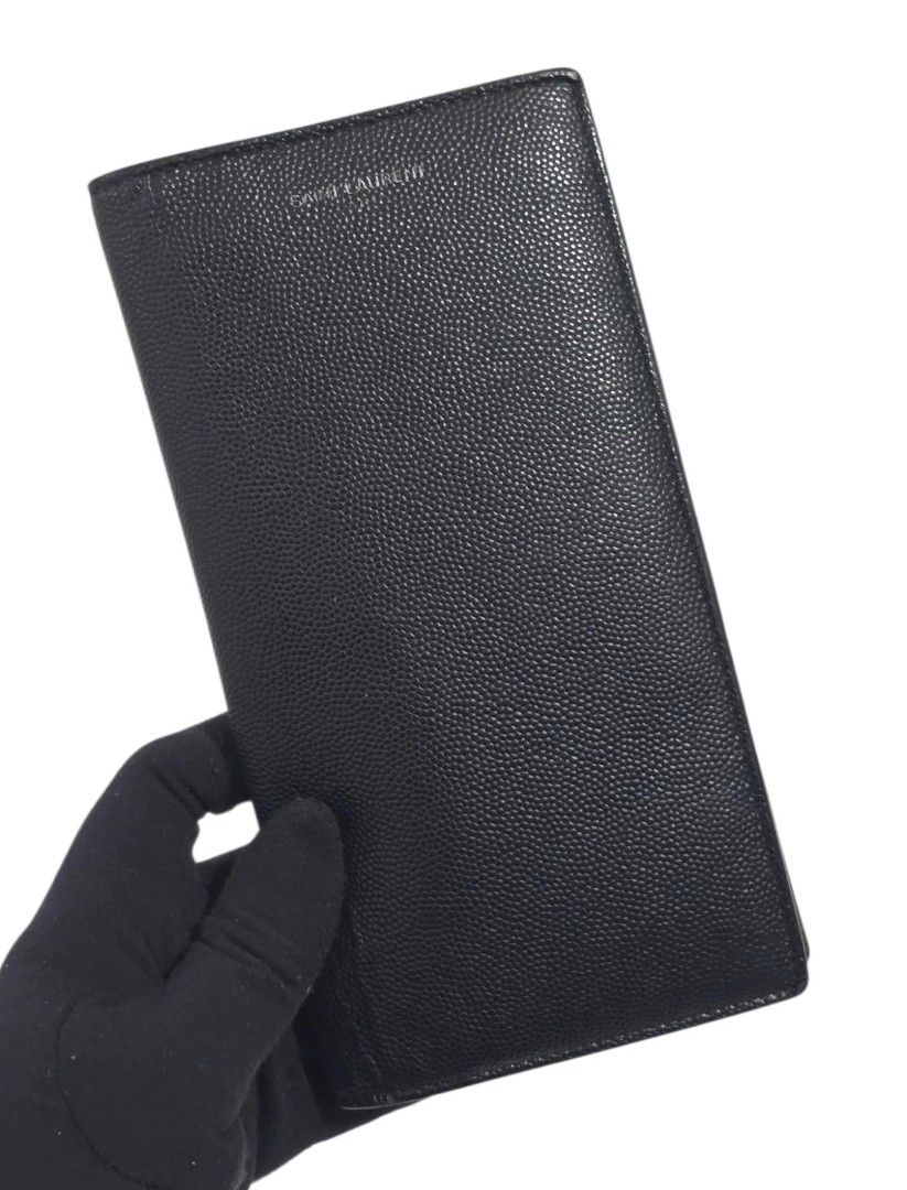 Authentic Saint Laurent Paris Black Grained Leather Long Wallet (Category: Wallets & Card Holders) located in Caloocan City. Submitted by love.purse (Listing ID 1461505867, Image 2). Description: - Authentic Saint Laurent Paris long wallet - Color: Black - Material: Grained leather exterior - Features: Embossed Saint Laurent logo - Interior: Multiple card slots and a zip compartment - Origin: Made in Italy - Benefit: Great for organizing your ess