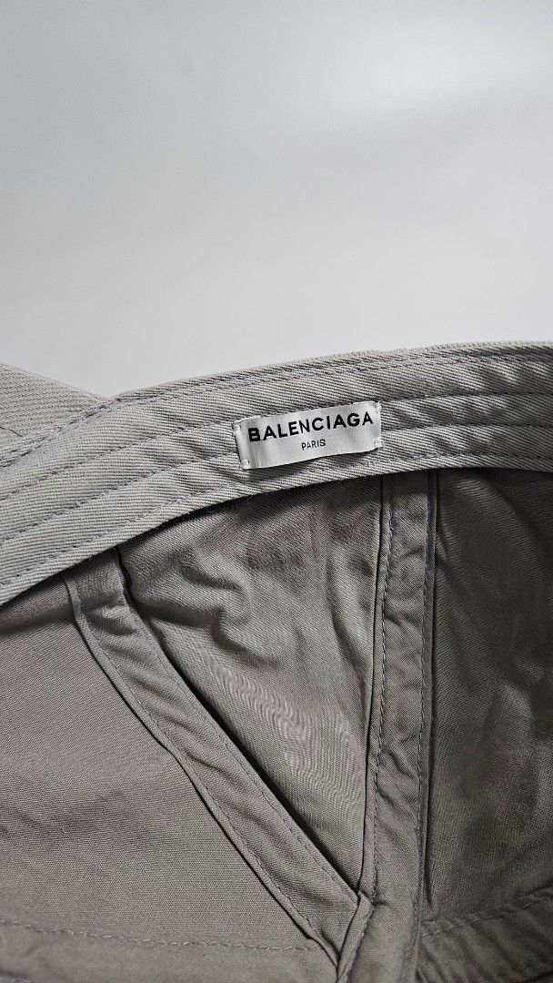 Balenciaga Paris Logo Baseball Cap (Category: Caps & Hats) located in Alfonso. Submitted by jbcamet (Listing ID 1461491941, Image 3). Description: - Authentic & guranteed Balenciaga Cap - Color: Grey - Iconic embroidered Balenciaga logo on front - Size: L (fits 58cm head circumference) - Ideal for everyday wear.