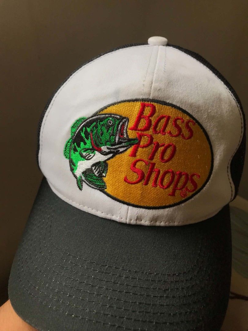 Bass Pro Shops Trucker Hat (Category: Caps & Hats) located in Manila. Submitted by mikeee03 (Listing ID 1461391838, Image 1). Description: - Classic Bass Pro Shops trucker hat - White front with iconic fish logo - Black mesh back for breathability - Adjustable strap for a custom fit - Ideal for fishing trips or everyday casual wear - Issue: None - need wash - What you see is what you will get 🥶.
