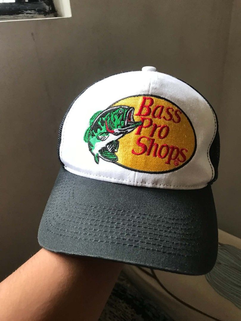 Bass Pro Shops Trucker Hat (Category: Caps & Hats) located in Manila. Submitted by mikeee03 (Listing ID 1461391838, Image 3). Description: - Classic Bass Pro Shops trucker hat - White front with iconic fish logo - Black mesh back for breathability - Adjustable strap for a custom fit - Ideal for fishing trips or everyday casual wear - Issue: None - need wash - What you see is what you will get 🥶.