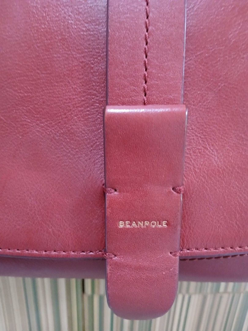 Beanpole Red Leather Crossbody Bag (Category: Cross-body Bags) located in Taguig. Submitted by demsclosetph (Listing ID 1461380516, Image 3). Description: - Genuine red leather crossbody bag by Beanpole - Adjustable long strap for comfortable wear - Secure buckle closure with embossed Beanpole logo - Interior zippered pocket for essentials - Ideal for everyday style and convenience.