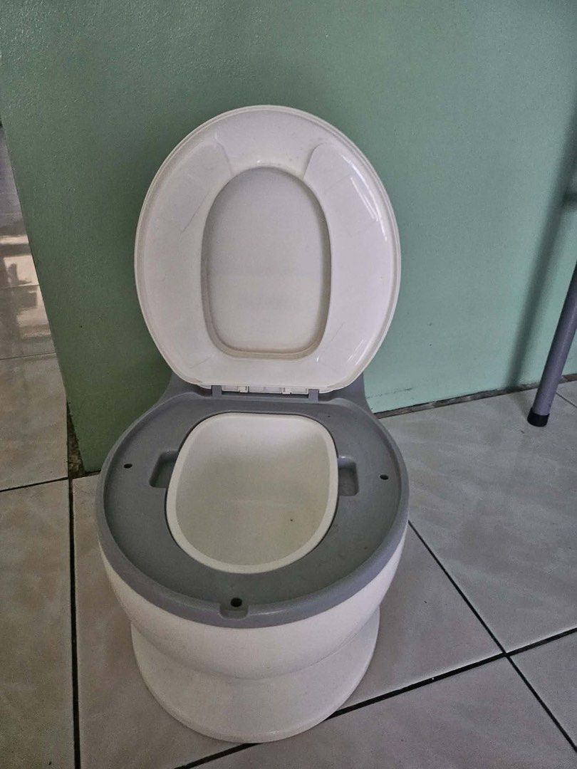 Bebeta Potty Training Toilet Seat (Category: Toilet Training) located in Quezon City. Submitted by fatcatgang (Listing ID 1461360724, Image 2). Description: Bebeta potty training toilet (white/grey). Features a lifting lid and removable inner potty for easy cleaning. Sturdy design to help your child learn to use the toilet. Not really used, na stock na lang and nalakihan.
