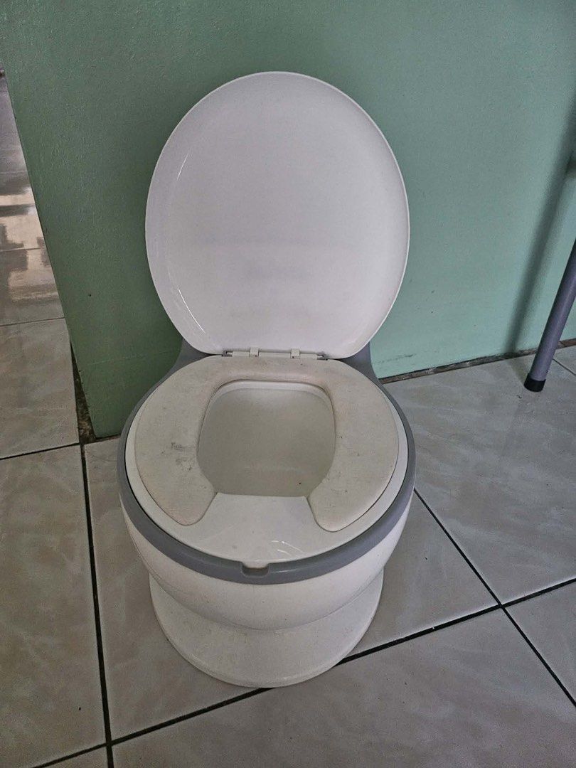 Bebeta Potty Training Toilet Seat (Category: Toilet Training) located in Quezon City. Submitted by fatcatgang (Listing ID 1461360724, Image 3). Description: Bebeta potty training toilet (white/grey). Features a lifting lid and removable inner potty for easy cleaning. Sturdy design to help your child learn to use the toilet. Not really used, na stock na lang and nalakihan.