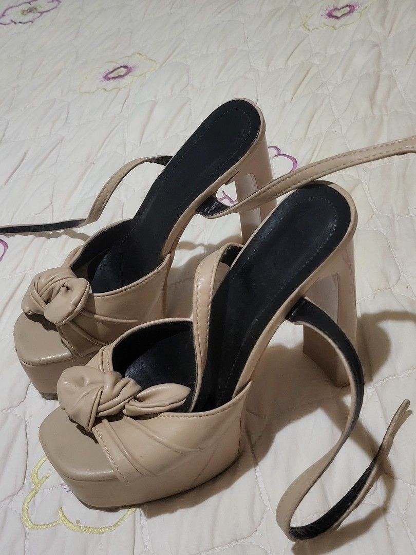Beige Bow Platform Wedge Sandals with Ankle Strap (Category: Wedges) located in Manila. Submitted by calmmountain.887b60 (Listing ID 1461335219, Image 1). Description: - Cute beige platform wedge sandals - Features a bow detail on the front strap - Adjustable ankle strap for a secure fit - Comfortable platform and wedge heel - Versatile for dressing up or down.