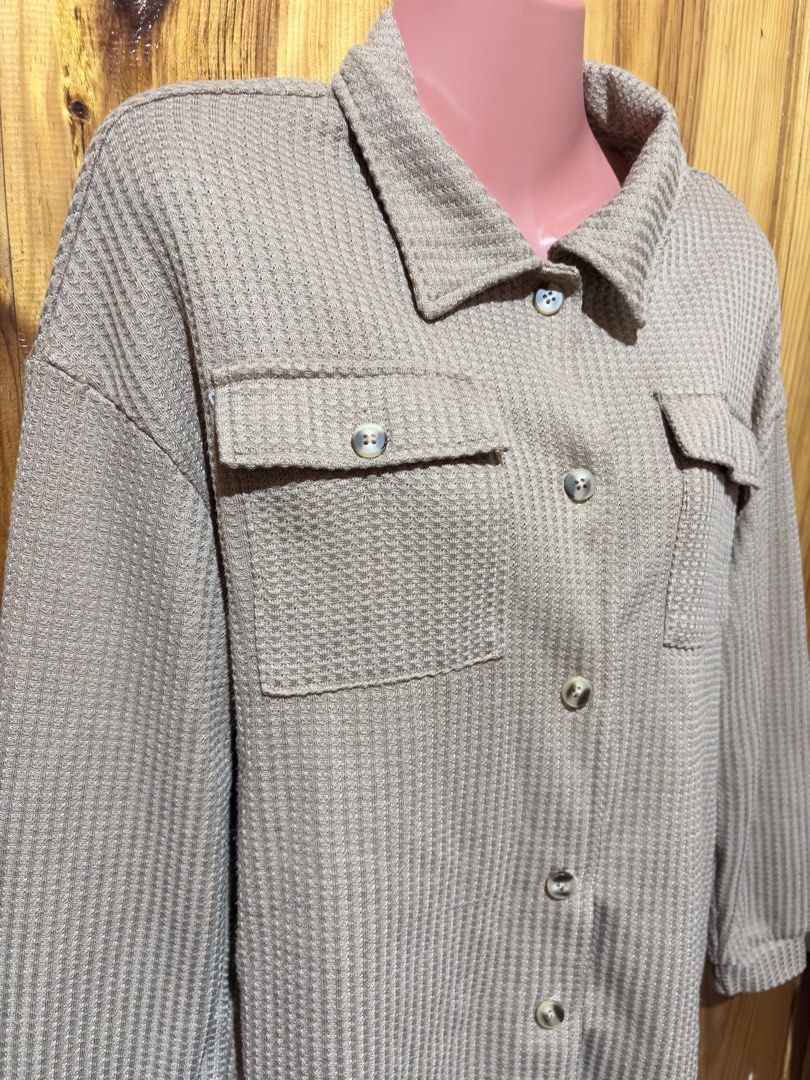 Beige Waffle Knit Button-Up Shirt Jacket with Pockets (Category: Coats, Jackets and Outerwear) located in Baguio. Submitted by declutterbycys (Listing ID 1461426055, Image 2). Description: - Beige waffle knit shirt jacket - Button-up front - Two chest pockets - Long sleeves with button cuffs - Relaxed fit, ideal for layering - Super comfy and stylish - Versatile: goes with everything! Note: Color may vary due to lighting.