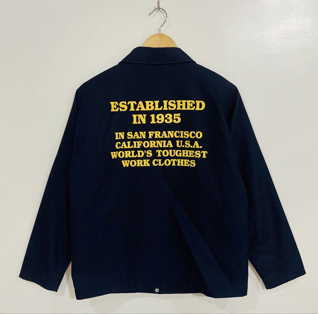 Ben Davis Work Jacket Established 1935 San Francisco Size S (Category: Coats, Jackets and Outerwear) located in Manila. Submitted by thriftnijuan08 (Listing ID 1461342918, Image 2). Description: - Navy blue Ben Davis jacket - Features 'BEN'S' logo on the front - Back print: 'Established in 1935 in San Francisco California U.S.A. World's Toughest Work Clothes' - Material: Polyester and cotton blend - Tagged size: S - Ideal for everyday wear -Dimes