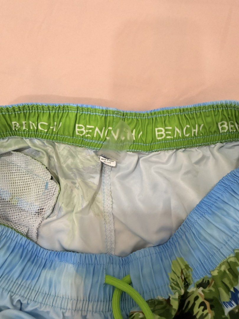 BENCH SWIM SHORTS - TROPICAL PRINT (Category: Shorts) located in Abulug. Submitted by joysmithznjo (Listing ID 1461433564, Image 2). Description: - Tropical resort print swim shorts - Drawstring waist for adjustable fit - Built-in mesh lining - Features the Bench logo on the waistband - Ideal for beach or pool days - Ready for your next vacation adventure!.