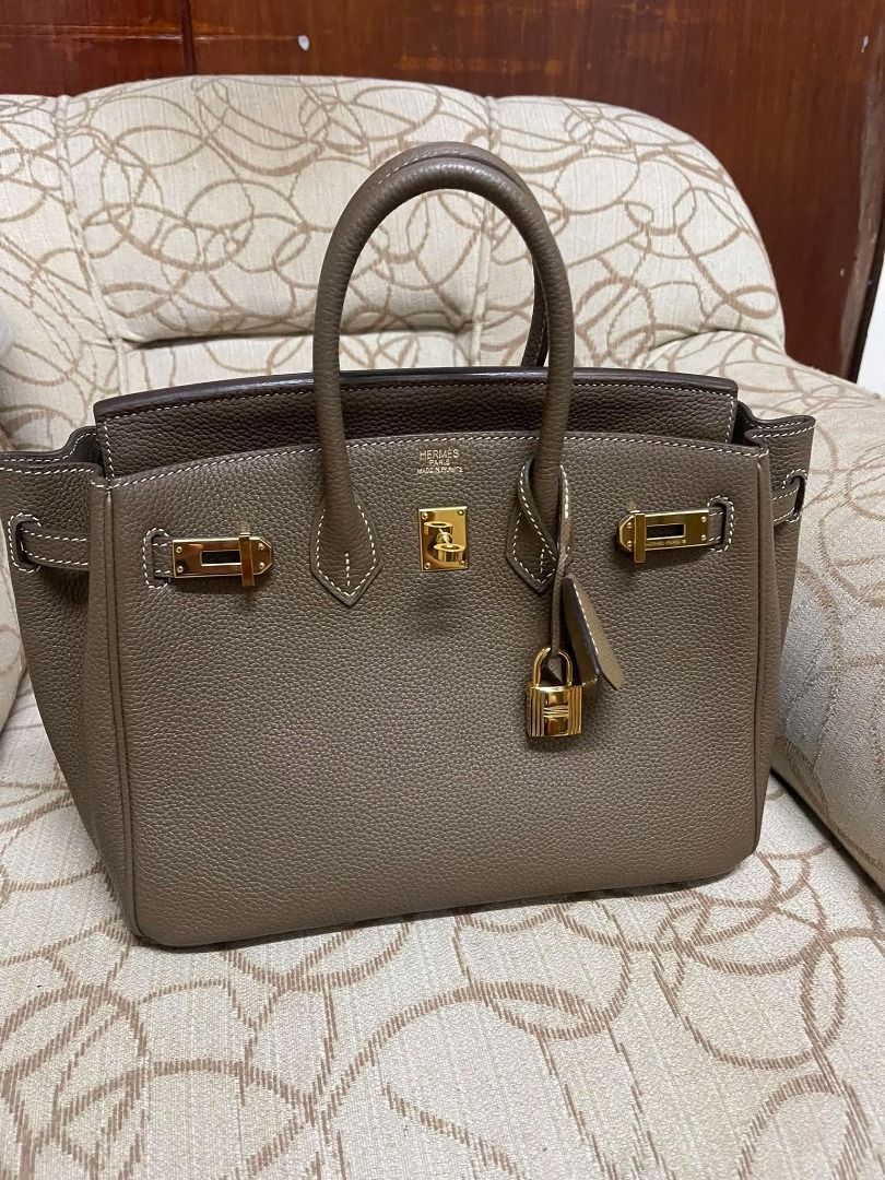 Birkin 25 Etoupe Togo (Category: Luxury Bags & Wallets) located in Las Pinas. Submitted by missfaust (Listing ID 1461339287, Image 1). Description: Classic Hermes handbag gold hardware .