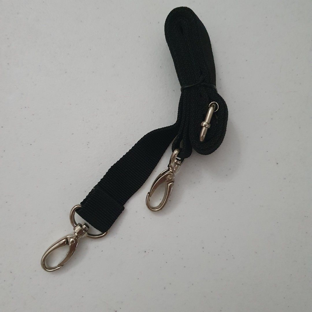 Black Adjustable Strap with Metal Clasps (Category: Other Accessories) located in Paranaque City. Submitted by cobien (Listing ID 1461419718, Image 1). Description: - Adjustable black strap - Two silver-toned metal clasps - Versatile for bags and accessories - Simple and functional design.