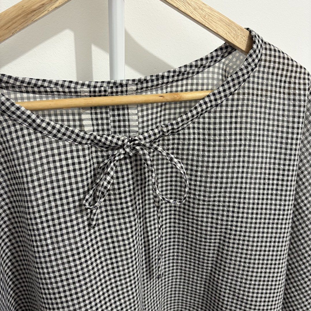 Black and White Gingham Tie-Neck Blouse (Category: Blouses) located in Quezon City. Submitted by thisisshobe (Listing ID 1461476936, Image 2). Description: 🌊 NOTE: Kindly read the reminders posted in the product slideshow. Follow us on our Social Media Page: Sunny Clothing PH 🌞 ——— 💫 Product Information • Brand: N/A • Size: Medium to Large • Details: Used Once.
