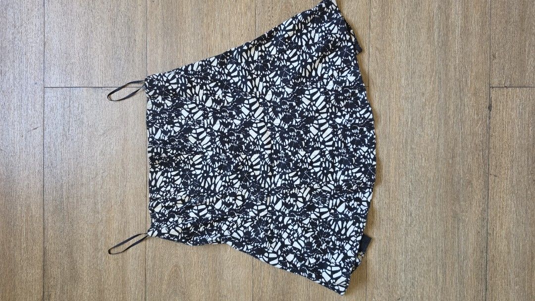 Black and White Patterned Mini Dress with Straps (Category: Others Tops) located in Quezon City. Submitted by jctan2019 (Listing ID 1461402669, Image 1). Description: - Adorable black and white patterned mini dress - Features delicate thin straps - Convenient zipper closure at the back - Fabric offers a comfortable stretch - Versatile for casual outings or a night out.