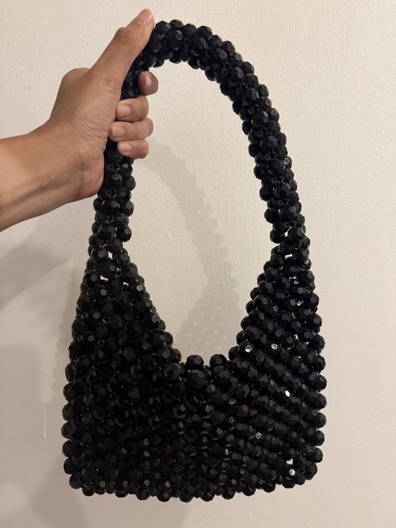 Black Beaded Shoulder Bag (Category: Shoulder Bags) located in Quezon City. Submitted by sabinalopez821 (Listing ID 1461482362, Image 1). Description: - Cute black shoulder bag with faceted, shiny beads. - Features a comfortable curved handle for shoulder wear. - Ideal for evening events or elevating your everyday look. .
