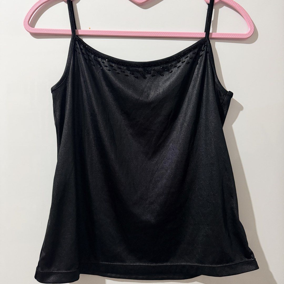 Black Camisole Top with Beaded Neckline (Category: Sleeveless) located in Guinobatan. Submitted by ktonkatsu (Listing ID 1461528630, Image 1). Description: - Sleek black camisole top - Features thin straps - Adorned with small beaded details at the neckline - Fabric has a subtle sheen - Versatile for layering or standalone wear.