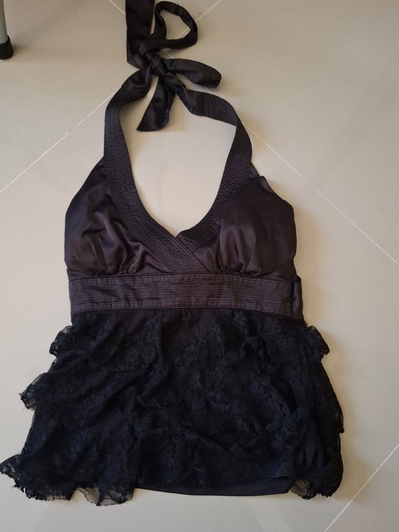 Black Halter Neck Lace Tiered Top (Category: Sleeveless) located in Bulacan. Submitted by ditchandswitch (Listing ID 1461417663, Image 2). Description: - Black halter neck top - Satin front with ribbed knit detail - Tiered lace hem - Ties at the neck with a bow - Ideal for nights out or parties.