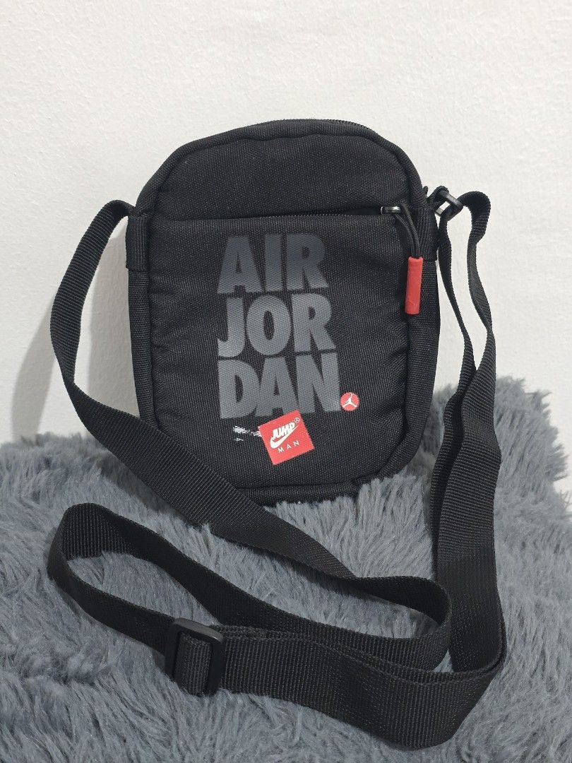 Black Jordan Crossbody Bag (Category: Sling Bags) located in Manila. Submitted by trialfindsmanila (Listing ID 1461502141, Image 1). Description: This is authentic 💯 from US Very good condition 💯 - Authentic Black Jordan Crossbody Bag - Features iconic Air Jordan logo on the front - Small red tag with Jumpman logo detail - Secure zipper closure - Adjustable strap for comfortable wear - Ideal for carrying your daily essentials Delivery or Pickup