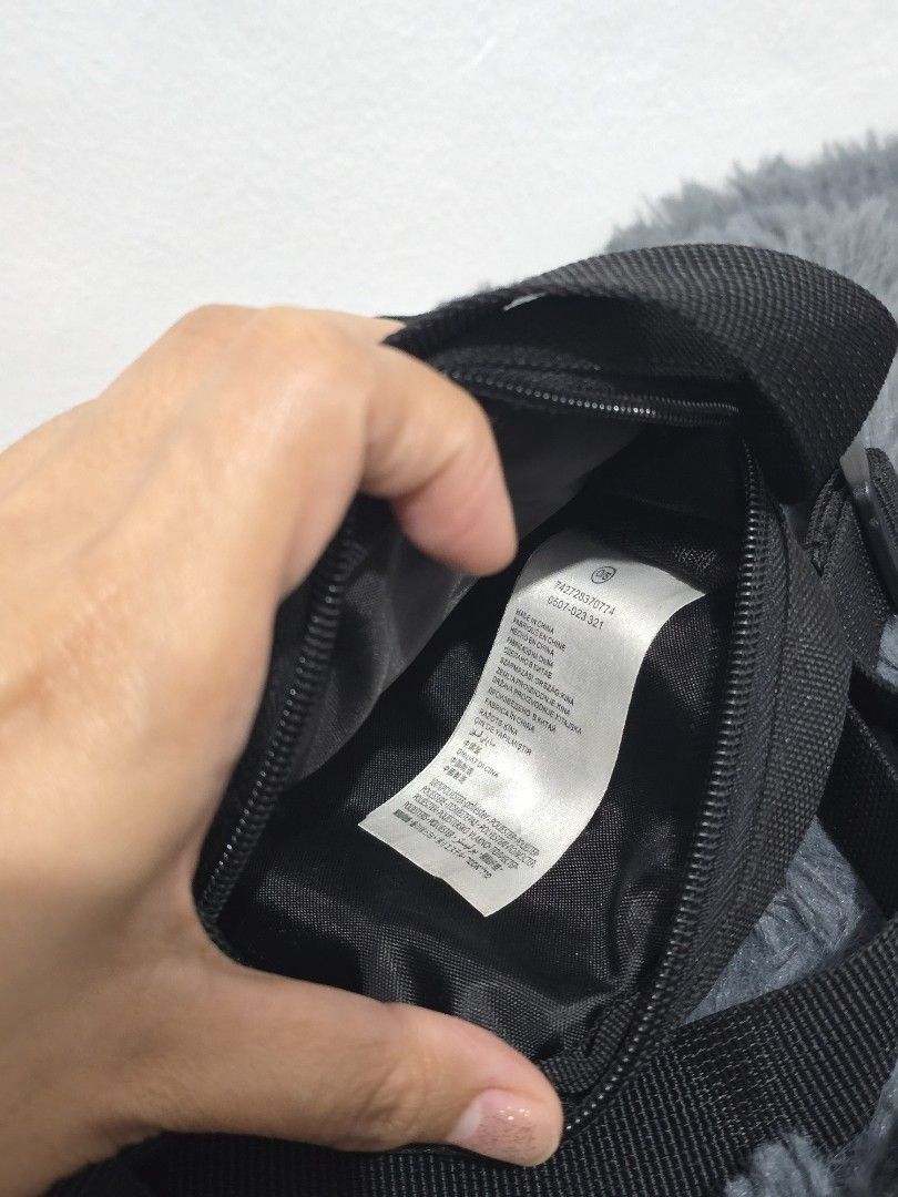 Black Jordan Crossbody Bag (Category: Sling Bags) located in Manila. Submitted by trialfindsmanila (Listing ID 1461502141, Image 2). Description: This is authentic 💯 from US Very good condition 💯 - Authentic Black Jordan Crossbody Bag - Features iconic Air Jordan logo on the front - Small red tag with Jumpman logo detail - Secure zipper closure - Adjustable strap for comfortable wear - Ideal for carrying your daily essentials Delivery or Pickup