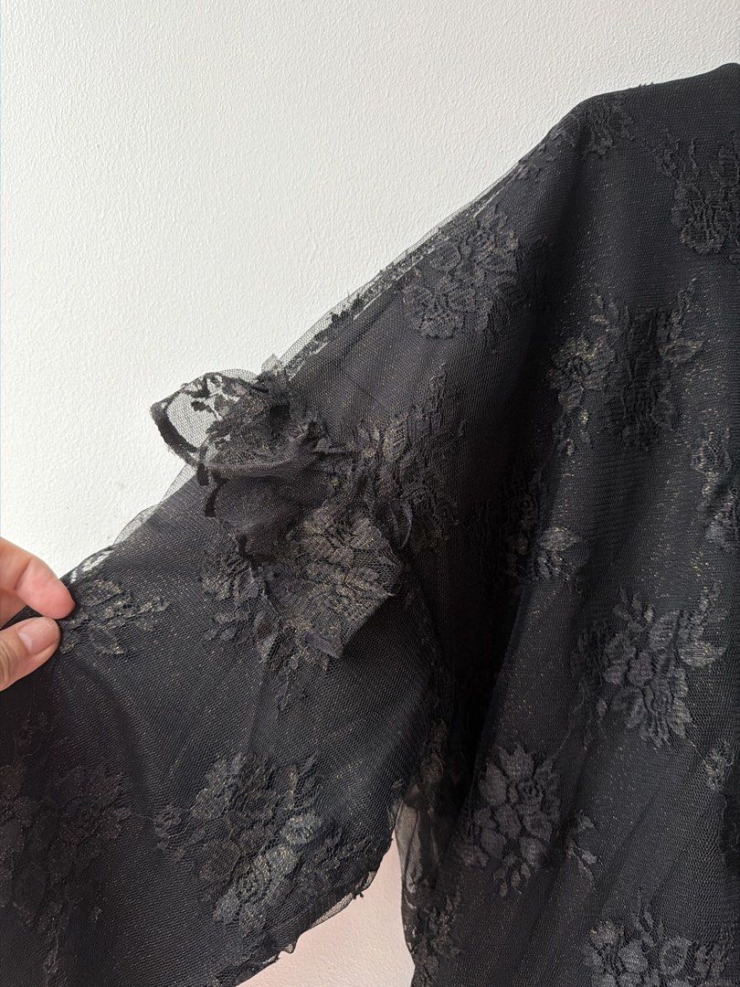 Black Lace Turtleneck Top with Ruffle Details Oversize (Category: Coats, Jackets and Outerwear) located in Makati City. Submitted by cheapipie (Listing ID 1461430217, Image 3). Description: -J KOO fall winter collection 2016 Vintage retails $245. - Elegant black lace turtleneck top - Beautiful all-over floral pattern - Stylish ruffle details on sleeves and hem - Versatile: great for layering or wearing on its own - Chest measurement: approximatel