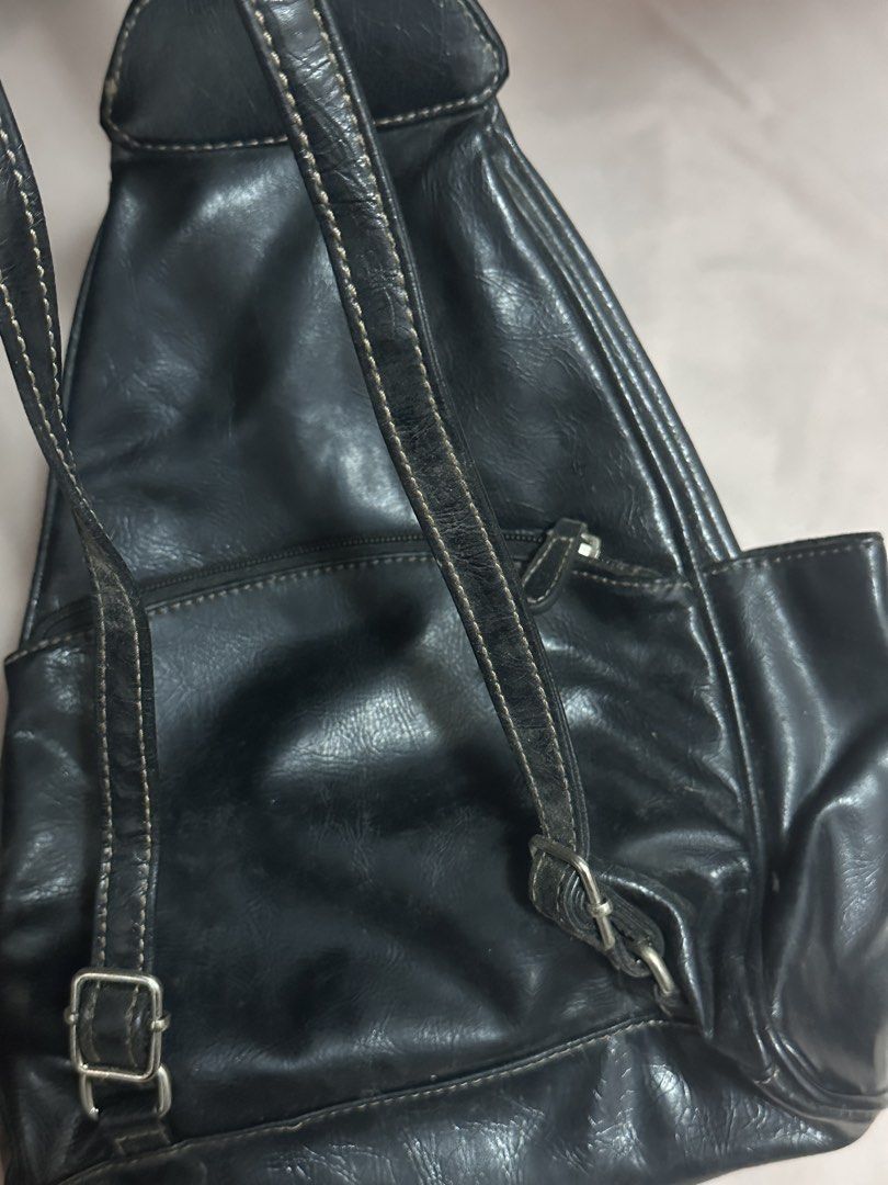 AVAIL - Black Leather Backpack with Front Pocket (Category: Backpacks) located in Baguio. Submitted by st0nefox (Listing ID 1461461355, Image 2). Description: - Classic black leather backpack - Main zippered compartment for secure storage - Front pocket with easy snap closure - Adjustable straps for a comfortable fit - Shows some signs of wear, as detailed in photos - Perfect for everyday adventures and essentials • baguio based (ship thru j&t) •