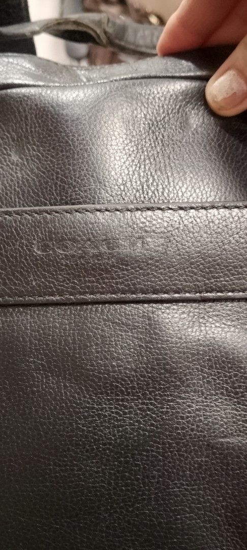coach original Black Leather Briefcase Bag (Category: Briefcases) located in Manila. Submitted by annemil_1984 (Listing ID 1461373716, Image 3). Description: - Genuine black leather briefcase - Made in the Philippines - Versatile: use as a briefcase or shoulder bag no issue almost new con - Top handles for easy carrying - Detachable shoulder strap included - Multiple convenient pockets on the front - Secure zipper closure - Ideal for professional