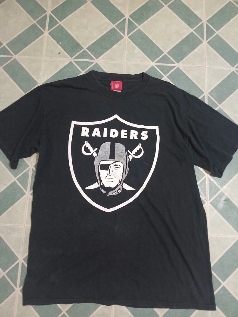 Black Raiders T-shirt (Category: Tshirts & Polo Shirts ) located in Pateros City. Submitted by m4ry.b0o (Listing ID 1461453599, Image 1). Description: - Classic black Raiders t-shirt - Features the iconic Raiders logo on the front - Short sleeves and crew neck design - Shows some signs of wear, adding character - Still has plenty of life left for casual wear - A must-have for any dedicated Raiders fan!.