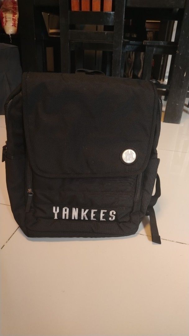 Black Shoulder Bag and Yankees Backpack (Category: Backpacks) located in Manila. Submitted by wildwind_73f77a (Listing ID 1461489721, Image 2). Description: - Black shoulder bag with stylish chain strap. - Black Yankees backpack included. - Backpack has a prominent Yankees logo on the front pocket. - Interior of the backpack features a name tag and MLB branding. - Ideal for everyday errands or your next travel adventure..