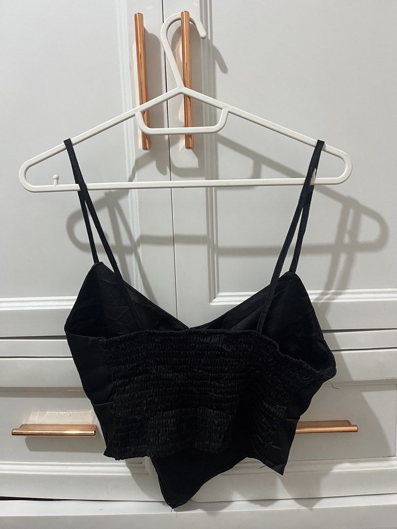 Black Smocked Back Crop Top with Spaghetti Straps (Category: Sleeveless) located in Pili. Submitted by jhamimin22 (Listing ID 1461389944, Image 2). Description: - Cute black crop top - Spaghetti straps - Flattering V-neckline - Smocked back for a comfortable, stretchy fit - Asymmetrical hemline - Perfect for dressing up or down, pair with jeans or a skirt.