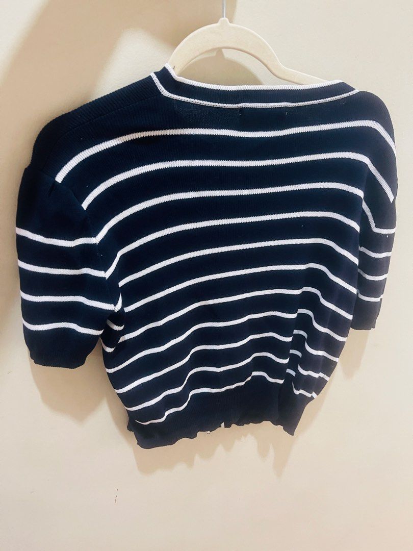 Black Striped Knit Top with Gold Buttons (Category: Shirts) located in Quezon City. Submitted by prelovedluxe_ (Listing ID 1461365428, Image 3). Description: Classic and effortlessly polished black striped knit top featuring elegant contrast piping and decorative gold-tone buttons. The timeless nautical-inspired stripe pattern is complemented by a refined round neckline and button-front detail, creating a sophisticated, feminine look. Made from a