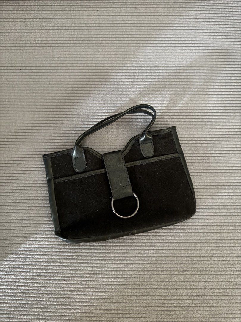 Black Suede Handbag with Silver Ring Detail (Category: Luxury Bags & Wallets) located in Pasig City. Submitted by justinebernabe_ (Listing ID 1461379837, Image 1). Description: - Classic black suede handbag - Sleek design with silver ring accent on front strap - Smooth black material handles - Spacious interior for essentials - Versatile for everyday use or nights out.