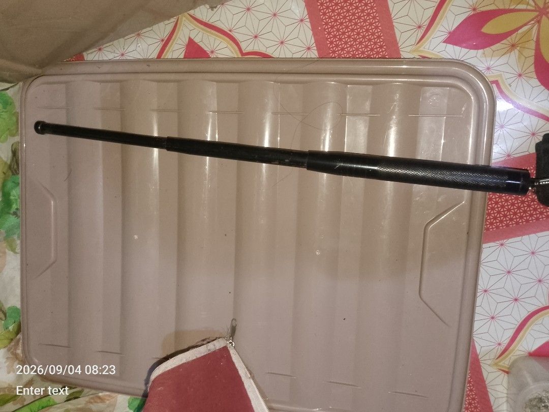 Black Telescopic Baton with Pouch (Category: Musical Instruments) located in Manila. Submitted by chollo24 (Listing ID 1461326775, Image 3). Description: - Black telescopic baton - Extends to full length - Includes fabric pouch for storage - Textured grip handle - Ideal for self-defense or collection - Please check photos for detailed condition.