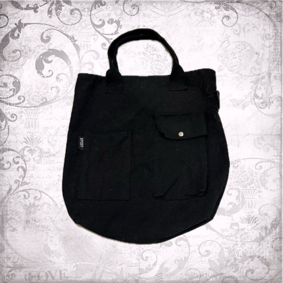 Black tote bag with pocket (Category: Tote Bags) located in Baguio. Submitted by yuridere (Listing ID 1461415646, Image 1). Description: width: 13in length: 14in - Shipping fee shall be covered by buyer ! - MOP: Gcash, Bank Transfer or Cash (for meet up) - Item is newly washed! Can be worn after purchase ^__^ - DM for inquiries & more photo examples !.